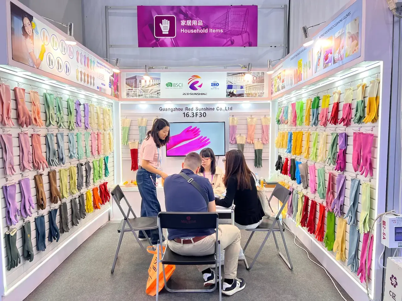 Red Sunshine team and a wide selection of rubber glove styles at an industry exhibition
